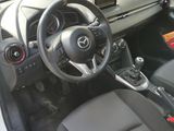 the interior of a car with a steering wheel and dashboard controls