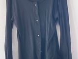 black long sleeved shirt with buttons on the front