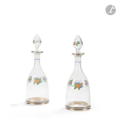 pair of glass decanters with flowers and leaves on them