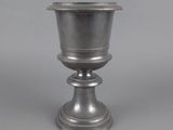 an image of a silver cup sitting on top of a table