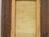an old picture frame with a picture of a man in a hat