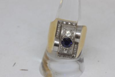 an image of a ring with a sapphire and diamonds