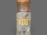 a small glass jar with a cork top and a cork lid