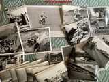 several black and white photos of people and vehicles on a bed