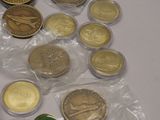 a lot of coins that are sitting on a table