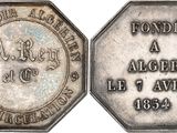 a close up of a silver coin with an inscription on it