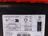 an image of a close up of the back of a red and black battery