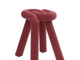 a red stool with four legs on a white background