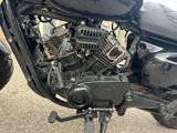 a close up of a motorcycle engine on a street