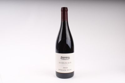 a bottle of wine that is sitting on a table
