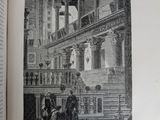 an open book with a picture of a building in it