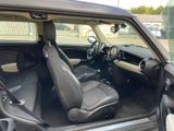 the interior of a car with the door open and the passenger seat up