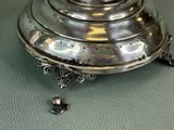 a silver plate that is sitting on a table