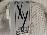 a close up of a white t - shirt with a black x on it