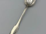 silver spoon with a spoon handle on a white surface