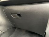 the interior of a car with the door open showing the interior of the vehicle