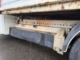 a close up of a truck with rust on the side of it