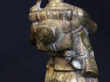 statue of a woman holding a baby in her arms on a black background