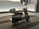 a scooter that is parked in a garage