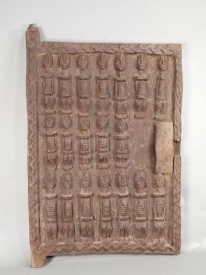 an image of a stone plaque with carvings on it