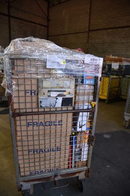a cart with a bunch of boxes on it in a warehouse
