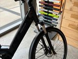 a bike that is parked in front of a book rack