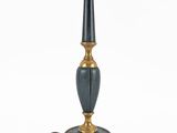 a black and gold table lamp with a black base
