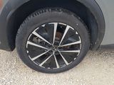 a close up view of a tire on a car