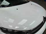 a white car that is parked in a garage