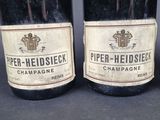 three bottles of wine are lined up on a table