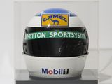 helmet in a clear display case with a logo on it