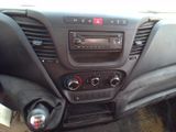 the dashboard of a car with a radio and a steering control