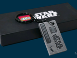 a black box with a lego star wars keychain on it