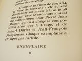 a close up of an open book with writing on it