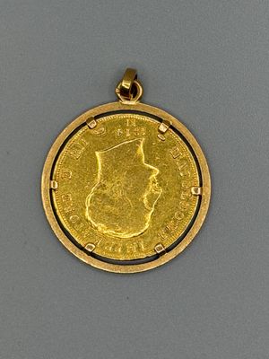 l'image d'une pièce d'or sur laquelle figure le visage d'une femme