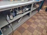 bottles of alcohol are lined up on a shelf in a store