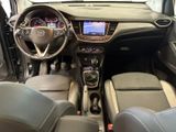 the interior of a small car with a steering wheel and dashboard
