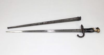 pair of old swords on a white table with a white background