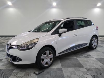 the white car is parked on a checkered tile floor