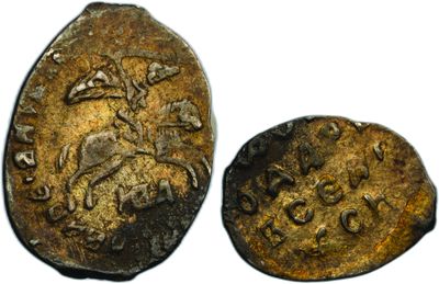 a close up of a coin with a picture of a man on a horse