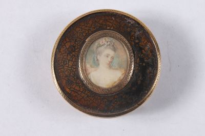 a picture of a woman in a picture frame on a plate
