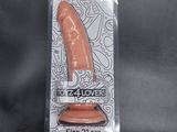 the flesh toy is in a plastic package on a black surface