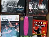 many books in a box that are sitting on a table