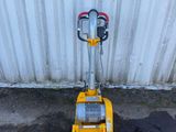 an image of a small machine that is on the ground