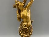 brass statue of a man with a bird on his shoulder
