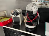 a coffee maker sitting on a counter in a kitchen