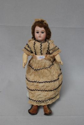 an image of a doll of a woman in a dress