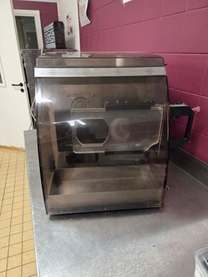 stainless steel counter top in a commercial kitchen with a toaster oven