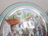 a plate with a picture of a group of people on it