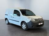 the white van is parked in a white room with a black floor